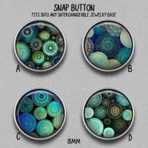 May include: Four circular snap buttons labeled A, B, C, and D, each 18mm in diameter. The buttons feature intricate teal, blue, and gold mandala-style patterns on a dark background. The text SNAP BUTTON FITS INTO ANY INTERCHANGEABLE JEWELRY BASE is visible.