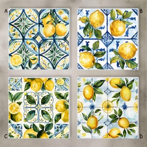 May include: Four square ceramic tiles with watercolor illustrations of lemons and leaves on a blue and white patterned background. Each tile features a different arrangement of lemons and foliage, creating a cohesive set.
