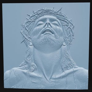 May include: A light blue monochromatic relief sculpture depicting a bearded figure with eyes closed, wearing a crown of thorns. The figure has long hair and visible textures representing liquid or tears flowing down the face and chest area.