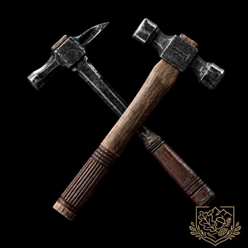 May include: Two crossed hammers with dark, weathered metal heads and textured wooden handles. One hammer features a pointed pick end, while the other has a flat head with the embossed text GENTLEMAN CHISEL visible on the metal surface.
