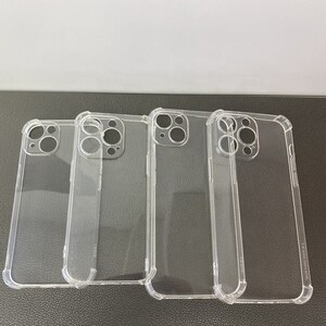 May include: Four clear plastic phone cases for an iPhone. The cases are all the same design, with a raised lip around the camera lens and a slightly textured finish.