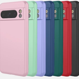 May include: A row of seven smartphone cases in various solid colours including light pink, mint green, lavender, navy blue, dark green, red, and black. Each case features a horizontal camera cutout at the top with two circular lens openings.