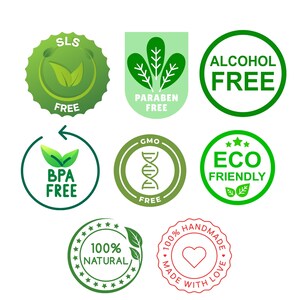 May include: Green and white labels with various text, including "SLS Free", "Alcohol Free", "Paraben Free", "GMO Free", "BPA Free", "Eco Friendly", "100% Natural", and "100% Handmade with Love".