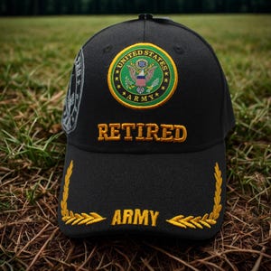 May include: Black baseball cap with the words "RETIRED ARMY" embroidered in gold. The cap features a circular patch with the words "UNITED STATES ARMY" and an eagle emblem. A gold laurel wreath design is on the brim.