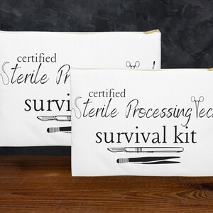 May include: Two white zippered pouches with the text "certified sterile processing tech survival kit" printed in black. The pouches feature black illustrations of surgical tools.