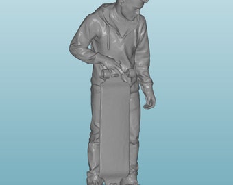 May include: A gray 3D printed figurine of a person standing with a skateboard. The person is wearing a hooded sweatshirt and jeans. The skateboard is on a small base.
