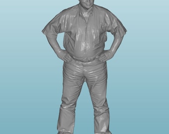 May include: A gray 3D printed figurine of a person standing with their hands on their hips.