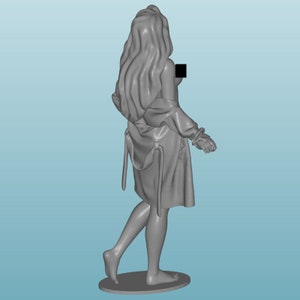 May include: A grey figurine of a person wearing a robe. The figurine is standing on a round base.