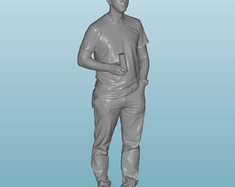 May include: A gray 3D printed figurine of a person wearing a t-shirt and jeans, holding a cylindrical object in their right hand.