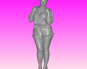 May include: A gray 3D-printed figurine of a woman in a romper with a wrap-style top and shorts. The romper has a tie at the waist and ruffled edges. The woman is standing on a circular base against a pink background.