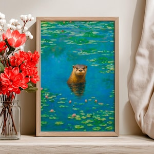 May include: A framed art print featuring an otter swimming in a pond with lily pads and pink flowers. The artwork has a painterly style with shades of blue, green, and brown. The frame is made of light-colored wood.