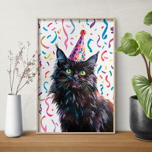 May include: A black cat wearing a purple and pink party hat with confetti in the background.