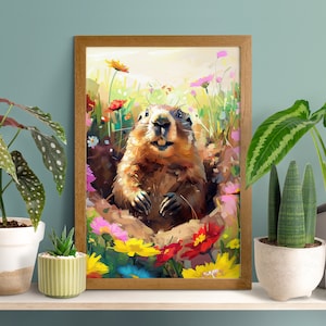 May include: A framed wall art print featuring a colourful, painterly illustration of a groundhog emerging from a burrow. The groundhog is surrounded by a vibrant field of yellow, red, pink, and blue wildflowers under a soft, light-filled sky.