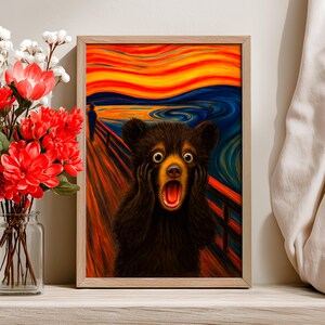 May include: Framed art print featuring a black bear with a surprised expression, mimicking the iconic "Scream" painting. The background showcases a vibrant, swirling sky in shades of orange, yellow, and blue, with a figure on a bridge.