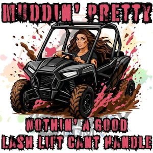 May include: A graphic illustration of a person with long brown hair driving a black off-road vehicle through mud. The text MUDDIN' PRETTY is at the top, and NOTHIN' A GOOD LASH LIFT CANT HANDLE is at the bottom in distressed pink lettering.