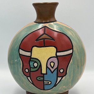 Jarrón con rostro abstracto: Cerámica peruana de Chulucanas - Cerámica rústica