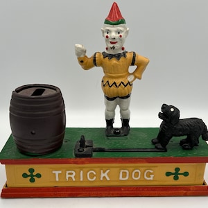 Alcancía vintage de hierro fundido para trucos de perro