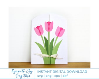 Puede incluir: Una tarjeta blanca con un diseño recortado de tres tulipanes rosas con tallos y hojas verdes. Una cinta color crema está atada alrededor de los tallos. El texto "INSTANT DIGITAL DOWNLOAD" es visible.