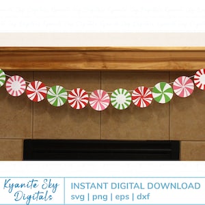 May include: A red, green, and white peppermint candy cane garland with a string of twine hanging from a wooden mantel. The garland is made of paper and has a festive Christmas theme.