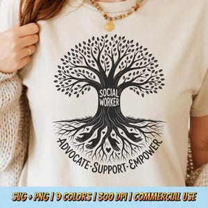 May include: Cream-colored t-shirt featuring a black tree design with the words "SOCIAL WORKER" in the center. The roots of the tree include the words "ADVOCATE SUPPORT EMPOWER". The shirt has short sleeves and a round neckline.