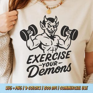 May include: Beige t-shirt featuring a black devil graphic lifting dumbbells, with the words "EXERCISE -YOUR- Demons". The image also includes the text "SVG + PNG | 9 COLORS | 300 DPI | COMMERCIAL USE".