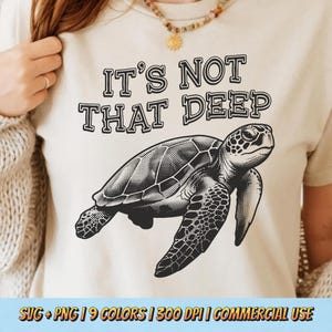 May include: A white ceramic mug with a black handle and the text "But First, Coffee" in a bold, black font. The mug is set against a blurred background, suggesting a cozy setting.