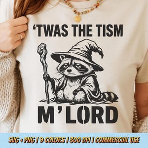 Twas The Tism M’Lord PNG SVG - Deadpan Neurodivergent Joke Wizard Raccoon Staff Absurd Fantasy Humor Retro Sublimation Graphic Shirt Design