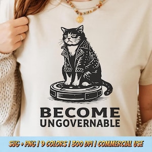 May include: A cream-coloured t-shirt with a black graphic of a cat in a studded leather jacket, perched on a robot vacuum. The words "BECOME UNGOVERNABLE" are printed beneath the cat. The bottom of the image includes text about the image's file type, colour options, and commercial use.