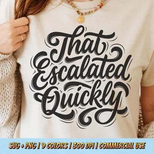 May include: A cream-colored t-shirt with the phrase "That Escalated Quickly" in large, black, stylized lettering. The design is centered on the shirt, with the text in a bold, cursive font. The shirt is a casual wear item.