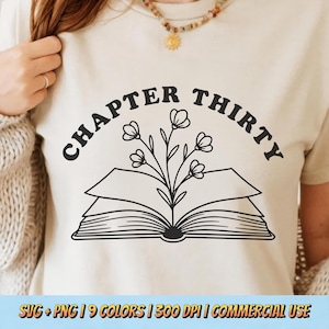 May include: Cream-colored t-shirt featuring a black graphic of an open book with flowers and the text "CHAPTER THIRTY" in a curved font. The bottom of the shirt has text that reads "SVG + PNG | 9 COLORS | 300 DPI | COMMERCIAL USE".