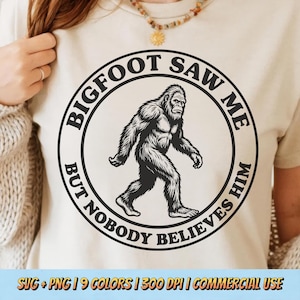 May include: Beige t-shirt with a black and white Bigfoot graphic inside a circular design. The text around the image reads "BIGFOOT SAW ME BUT NOBODY BELIEVES HIM". The shirt also has the text "SVG + PNG | 9 COLORS | 300 DPI | COMMERCIAL USE".