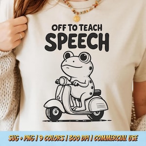 May include: A cream-colored t-shirt with the text "OFF TO TEACH SPEECH" above a cartoon frog riding a scooter. The frog is black and white, with large eyes and a serious expression. The bottom of the shirt has text that reads "SVG + PNG | 9 COLORS | 300 DPI | COMMERCIAL USE."
