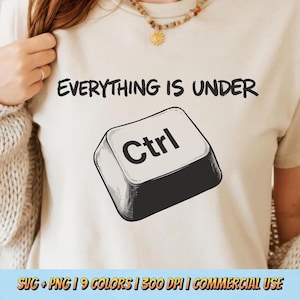 May include: A beige t-shirt with the phrase "EVERYTHING IS UNDER" printed in black above a large, detailed illustration of a "Ctrl" key. The image also includes text at the bottom: SVG + PNG | 9 COLORS | 300 DPI | COMMERCIAL USE.