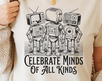 Może przedstawiać: Beżowa koszulka z grafiką trzech robotów z głowami w kształcie telewizora, tostera i radia. Pod robotami znajduje się napis "CELEBRATE MINDS OF ALL KINDS". Obraz zawiera również tekst "SVG + PNG | 9 COLORS | 300 DPI | COMMERCIAL USE."
