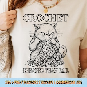 May include: A cream-colored t-shirt featuring a black and white illustration of an angry cat crocheting. The text "CROCHET" is above the cat, and "CHEAPER THAN BAIL" is below. The shirt also has the text "SVG + PNG | 9 COLORS | 300 DPI | COMMERCIAL USE".