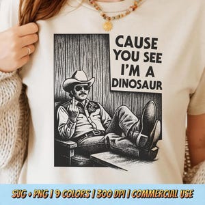 May include: Beige t-shirt featuring a black and white graphic of a man in a cowboy hat and sunglasses, with the text "CAUSE YOU SEE I'M A DINOSAUR". The image includes the text "SVG + PNG | 9 COLORS | 300 DPI | COMMERCIAL USE".