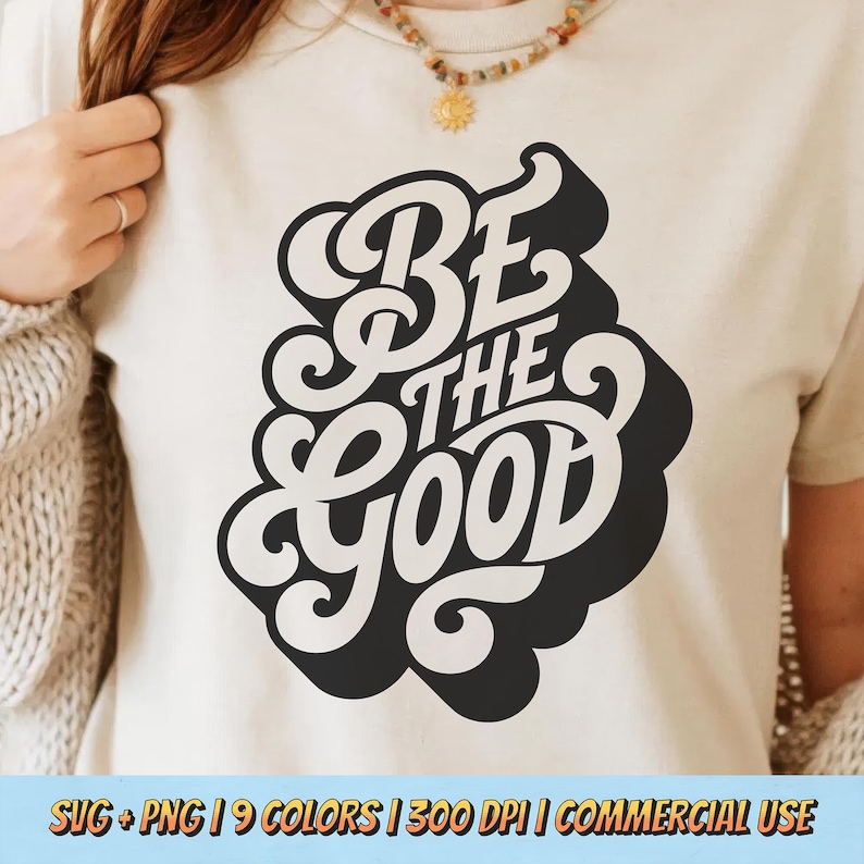 May include: Cream-colored t-shirt featuring the phrase "BE THE GOOD" in a retro, black and white design. The text is stylized with a bold, rounded font. The bottom of the image includes text: SVG + PNG | 9 COLORS | 300 DPI | COMMERCIAL USE.