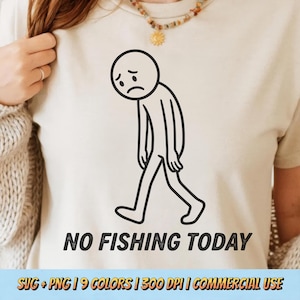 May include: Beige t-shirt featuring a black and white illustration of a dejected stick figure walking. The text "NO FISHING TODAY" is printed below the figure in a bold, sans-serif font. The shirt is a neutral color.