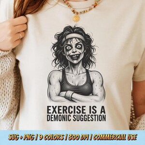 May include: A cream-colored t-shirt featuring a black and white illustration of a zombie-like figure in workout attire. The text "EXERCISE IS A DEMONIC SUGGESTION" is below the image. The bottom of the shirt has text that reads "SVG + PNG | 9 COLORS | 300 DPI | COMMERCIAL USE".