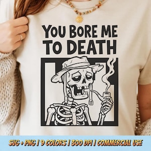 May include: A white ceramic mug with a black handle and the text "But First, Coffee" in a bold, black font. The mug is set against a blurred background, suggesting a cozy setting.