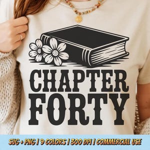 May include: A beige t-shirt featuring a black graphic of a book with two flowers and the words "CHAPTER FORTY". The bottom of the shirt has text that reads "SVG + PNG | 9 COLORS | 300 DPI | COMMERCIAL USE".