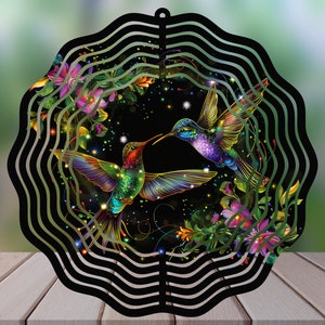 May include: A black metal wind spinner with a colorful hummingbird design. The hummingbird is surrounded by flowers and stars. The wind spinner is perfect for adding a touch of whimsy to any garden.