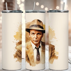 May include: A white stainless steel tumbler with a watercolor illustration of a man wearing a fedora and a suit. The background is a light brown with splashes of paint.