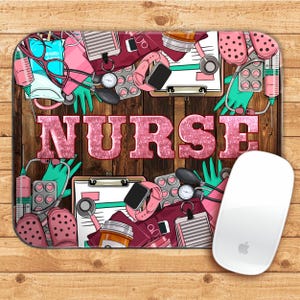 May include: A pink and white mouse pad with a woodgrain background. The mouse pad features a variety of medical supplies, including a stethoscope, a blood pressure cuff, and a syringe. The word "NURSE" is written in pink glitter letters across the top of the mouse pad.