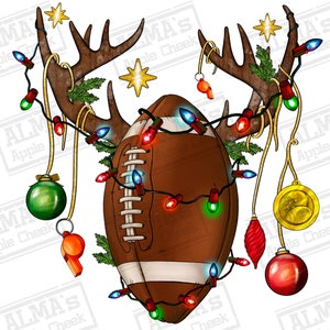 May include: A brown football with white stripes is decorated with a string of Christmas lights and ornaments. The football is attached to a pair of antlers with a green leafy garland.