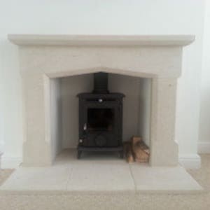 bespoke hand carved Bath stone surround and hearths