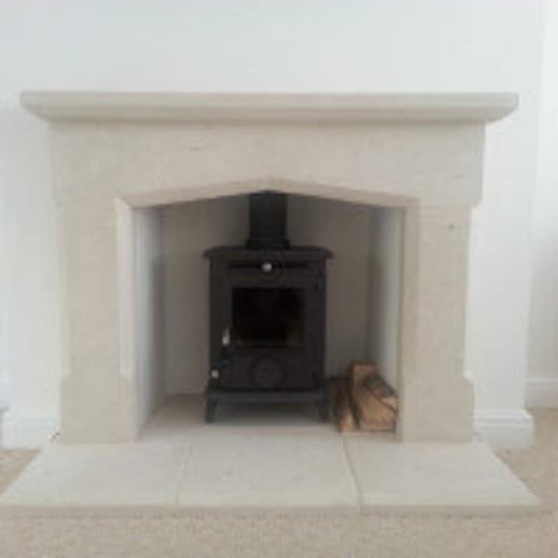 bespoke hand carved Bath stone surround and hearths