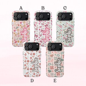May include: Five phone cases with different designs. Each case features a unique pattern of medical-themed icons, including stethoscopes, pills, and syringes, along with the name "Sophie" in a script font. The cases are in shades of pink, blue, and cream.