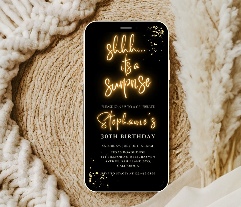 May include: A black and gold digital phone screen with a birthday party invitation. The text reads "Shh... it's a Surprise, Please join us to celebrate Stephanie's 30th Birthday, Saturday, July 18th at 6pm, Texas Roadhouse, 123 Billford Street, Rayven Avenue, San Francisco, California, RSVP to Stacey at 123-456-7890".
