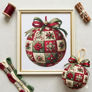 May include: A framed cross-stitch Christmas bauble with a red, green, and cream floral pattern. The bauble is spherical and has a green and red ribbon. Spools of thread and cinnamon sticks are also visible in the image.